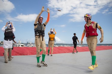 (Left to Right) Junior Oliver Doggart and seniors James Johnston, Sarmad Chaudhry and Ben Patterson walk on the flight deck to fire up onlookers at the National Redbull Flugtag competition Saturday. Kate Maier // Contributing Photographer
