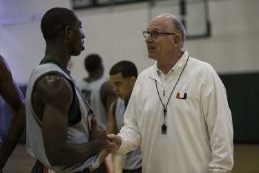 Men's Basketball Coach Jim Larranaga talks to freshman Davon Reed (5) during the Men's Basketball open media practice in September. Nick Gangemi // Assistant Photo Editor