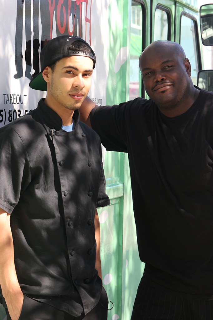 Alex Velasquez, a graduate of Empowered Youth, Inc. with mentor Chef Andy St. Ange at the VIBE 305 truck in Wynwood on Tuesday, Jan. 28, 2014. Chloe Herring // Contributing Photographer