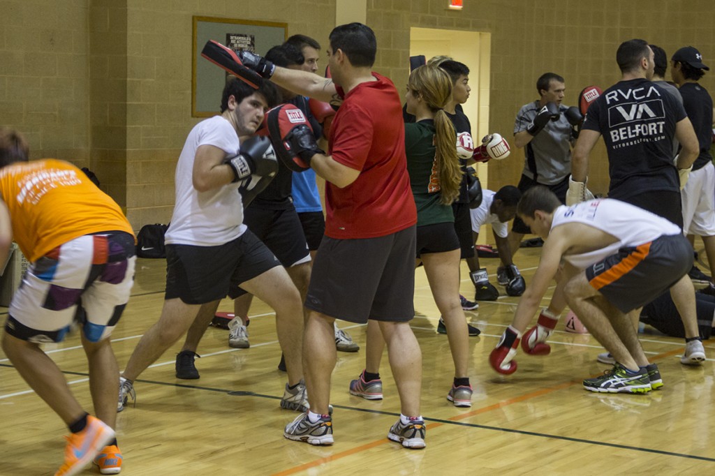 UM boxing club members spar during a practice conducted at Wellness Center on Thursday evening. The boxing club meets at 8 p.m. Tuesdays and Thursdays at the Wellness Center basketball courts.  Victoria McKaba // Staff Photographer