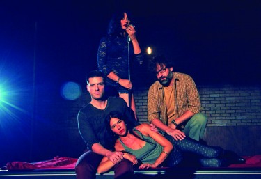 University of Miami alumna Mariand Torres grasps a microphone, which she uses throughout "Murder Ballad" to narrate the story of a love triangle gone wrong. Tom (Chris Crawford), Sara (Blythe Gruda) and Michael (Mark Sanders) share the spotlight in this show as the plot circles around the affair that ends in a murder. 