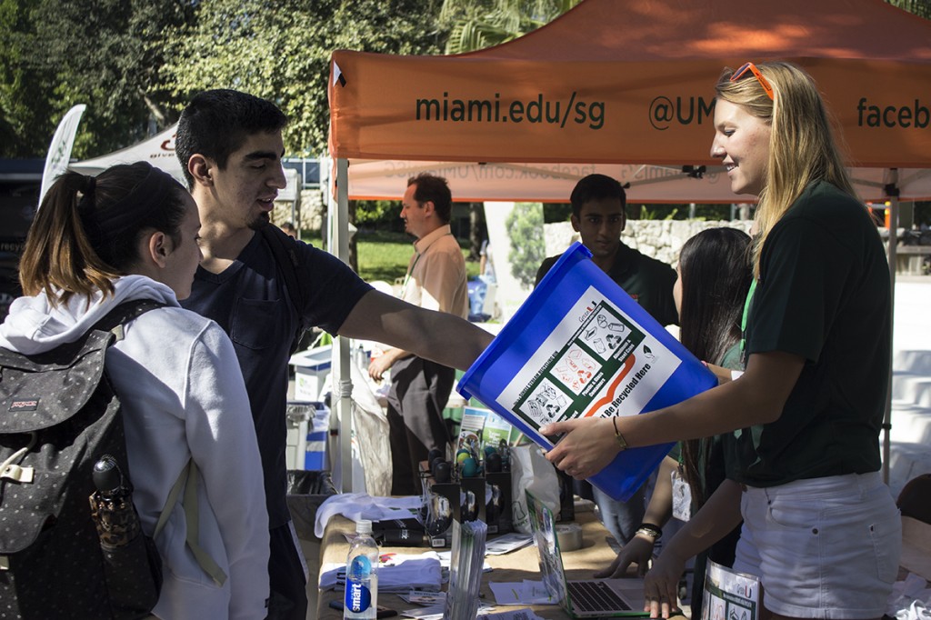Sophomore Christina Davila educates Junior Diego Aguilar on the benefits of recyling. America Recycles Day took place Wednesday at the Rock. Giancarlo Falconi // Staff Photographer