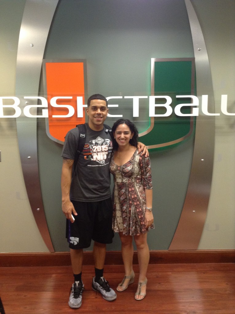 Reporter Elena Tayem with Canes point guard Angel Rodriguez