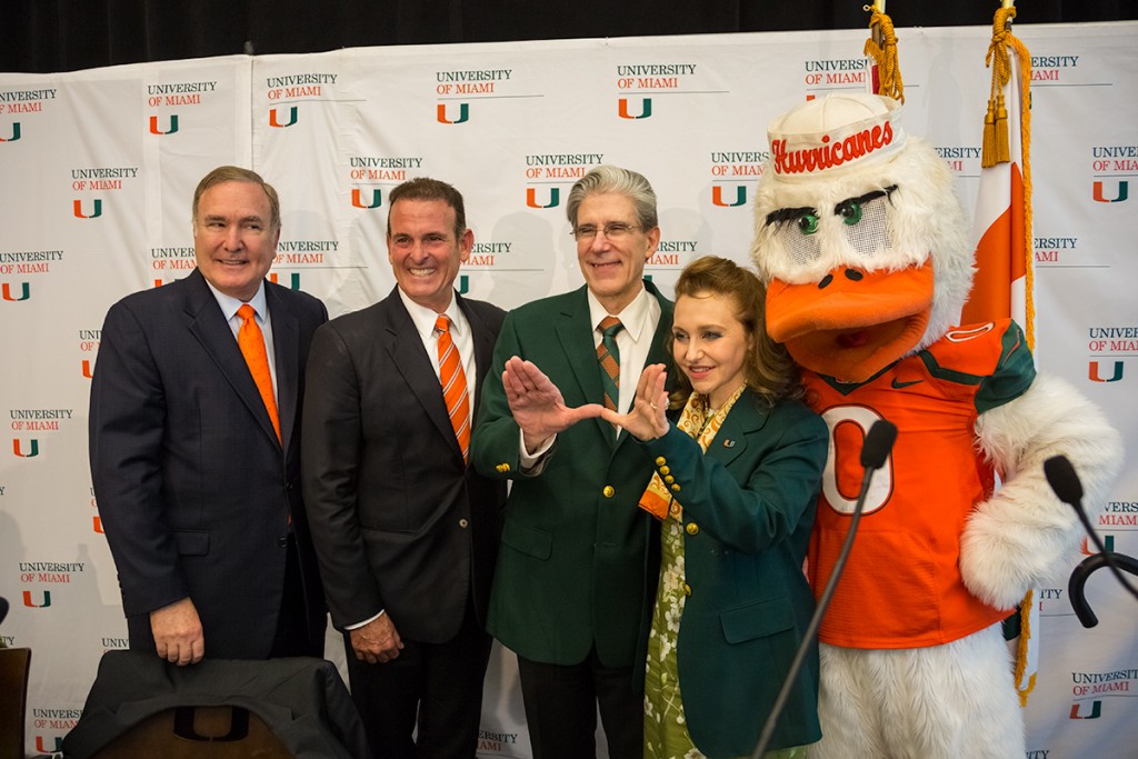 University of Miami President Elect Dr. Julio Frenk throws up the “U” along with his wife, Felicia Knaul after a press conference where the UM Presidential Search Committee announced their decision. UM Board of Trustees Vice Chair Richard Fain and Chair Stuart Miller also attended Monday’s event held at the SAC. Nick Gangemi // Photo Editor