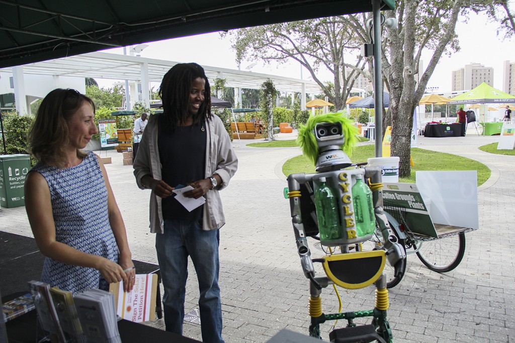 At the Energy and Conservation Organization's annual Green Fair Wednesday afternoon, Cycler, the Waste Management recycling robot, encourages visitors to make sustainable choices. Erum Kidwai // Staff Photographer