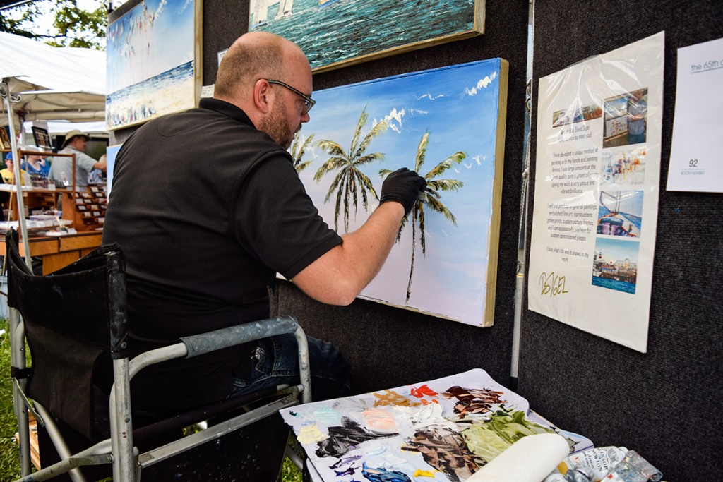 Artist David Sigel showcases his talent for painting natural Florida landscapes at the 65th annual Beaux Arts Festival on Saturday. The Festival of Art brings in artists from around the world in support of raising funds for the Lowe Art Museum. Evelyn Choi // Staff Photographer