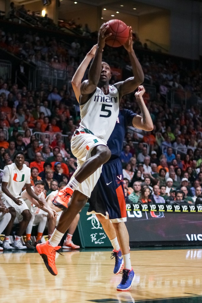 Junior guard Davon Reed jumps up for a shot during Monday night’s game against Virginia at the BankUnited Center. The Canes defeated the Cavaliers 64-61.