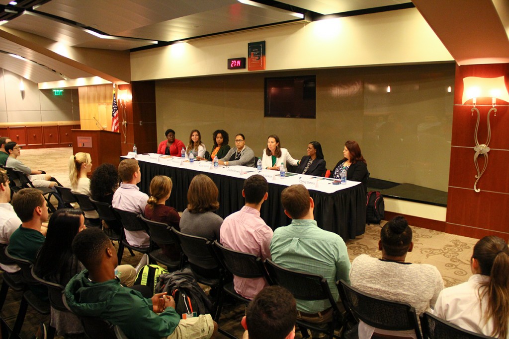 A panel, composed of Shadé Olasimbo, Alicia Jessop, Karai Lockley, Kysha Harriell, Jennifer Strawley, Shirelle Jackson, and Christy Chirinos, features women with careers in sports Monday at the Fieldhouse of the BankUnited Center. Hosted by Hurricane Athletics, the women described their experiences in the industry, highlighting their achievements and struggles with issues such as wage discrimination in a male-dominated profession. The speakers, collectively, had experience in the fields of journalism, management, academics and more. They stressed the topic of networking and social media being both harmful and helpful when looking for a career in athletics. Erum Kidwai // Assistant Photo Editor