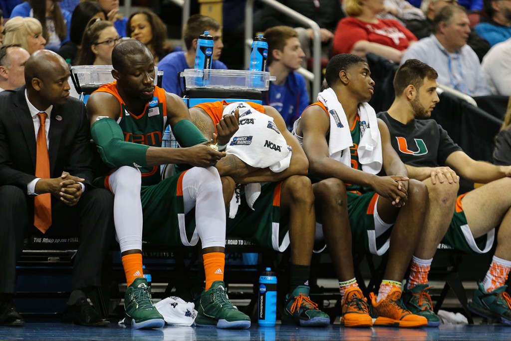 Miami Hurricanes men’s basketball players look on as Villanova defeats the Canes 92-69 during the Sweet 16 game in Louisville Thursday evening. Michael Reaves // Contributing Photographer
