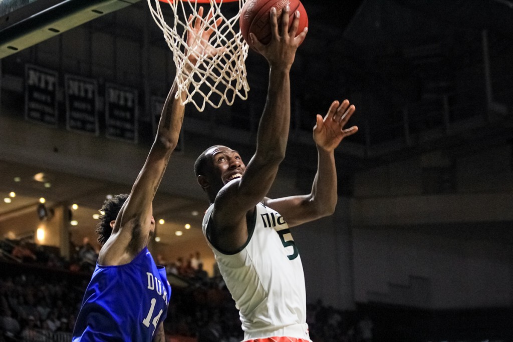 Junior guard Davon Reed (5) goes for a layup during the Canes 80-69 win against Duke at home in January. Victoria McKaba // Assistant Photo Editor