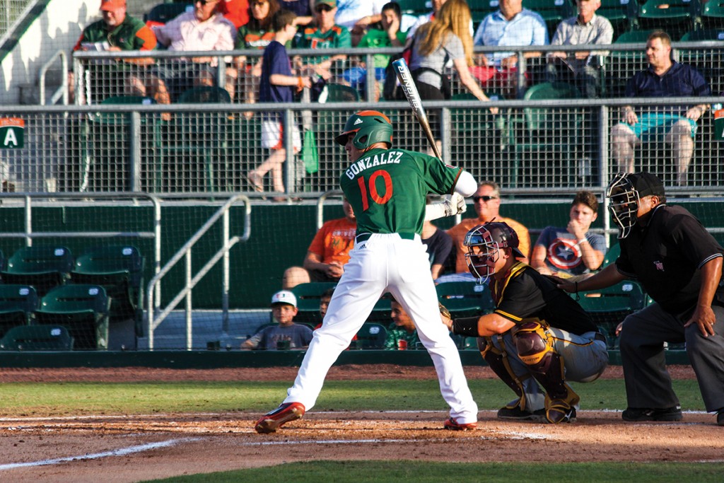 Freshman third baseman Romy Gonzalez (10) hits during the Hurricanes’ 5-4 win over Bethune-Cookman Wednesday night at Alex Rodriguez Park at Mark Light Field. Gonzalez hit a two-run single in the sixth inning to put the Canes up 5-3. Victoria McKaba // Assistant Photo Editor