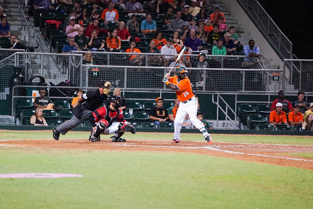 Junior left fielder Jacob Heyward (24) prepares to swing during his at-bat Saturday night at Alex Rodriguez Park at Mark Light Field. Hayward hit a two-run home run during the Hurricanes’ 6-3 victory over Louisville. The Canes won the series 2-1 following their loss on Sunday. Hunter Crenian // Contributing Photographer