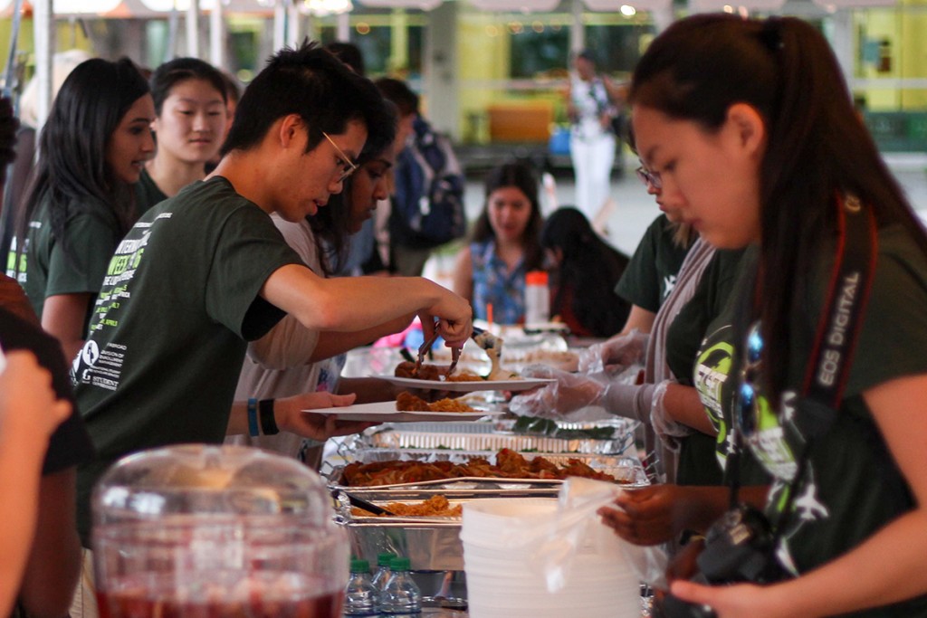 Students learn about different cultures and enjoy free food at the Middle Eastern night for the Council of International Students and Organizations' International Week at the Lakeside Patio Tuesday evening. Kawan Amelung // Staff Photographer