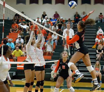 Sophomore outside hitter Lucia Pampana (11) spikes the ball during the Canes’ season opener against Florida A&M Friday evening in the James L. Knight Sports Complex. Joshua White // Contributing Photographer