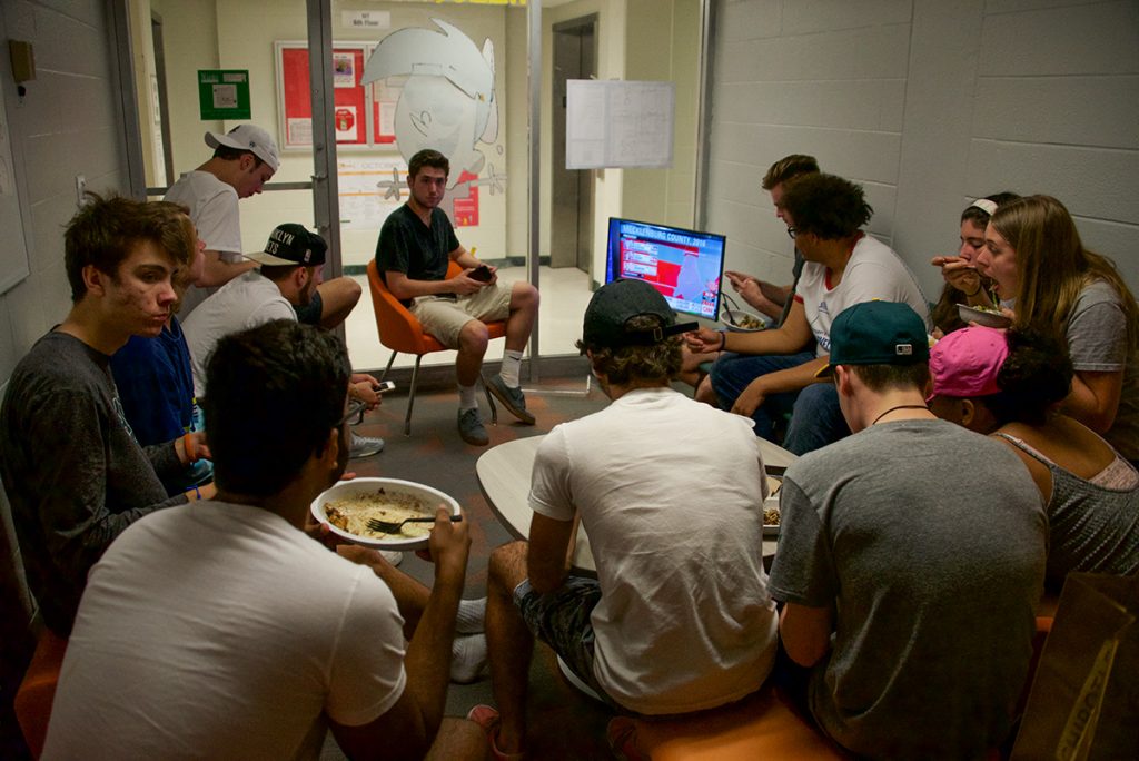 Freshman students watch the election reports Tuesday night in Hecht Residential College. Ben Spiro // Staff Photographer
