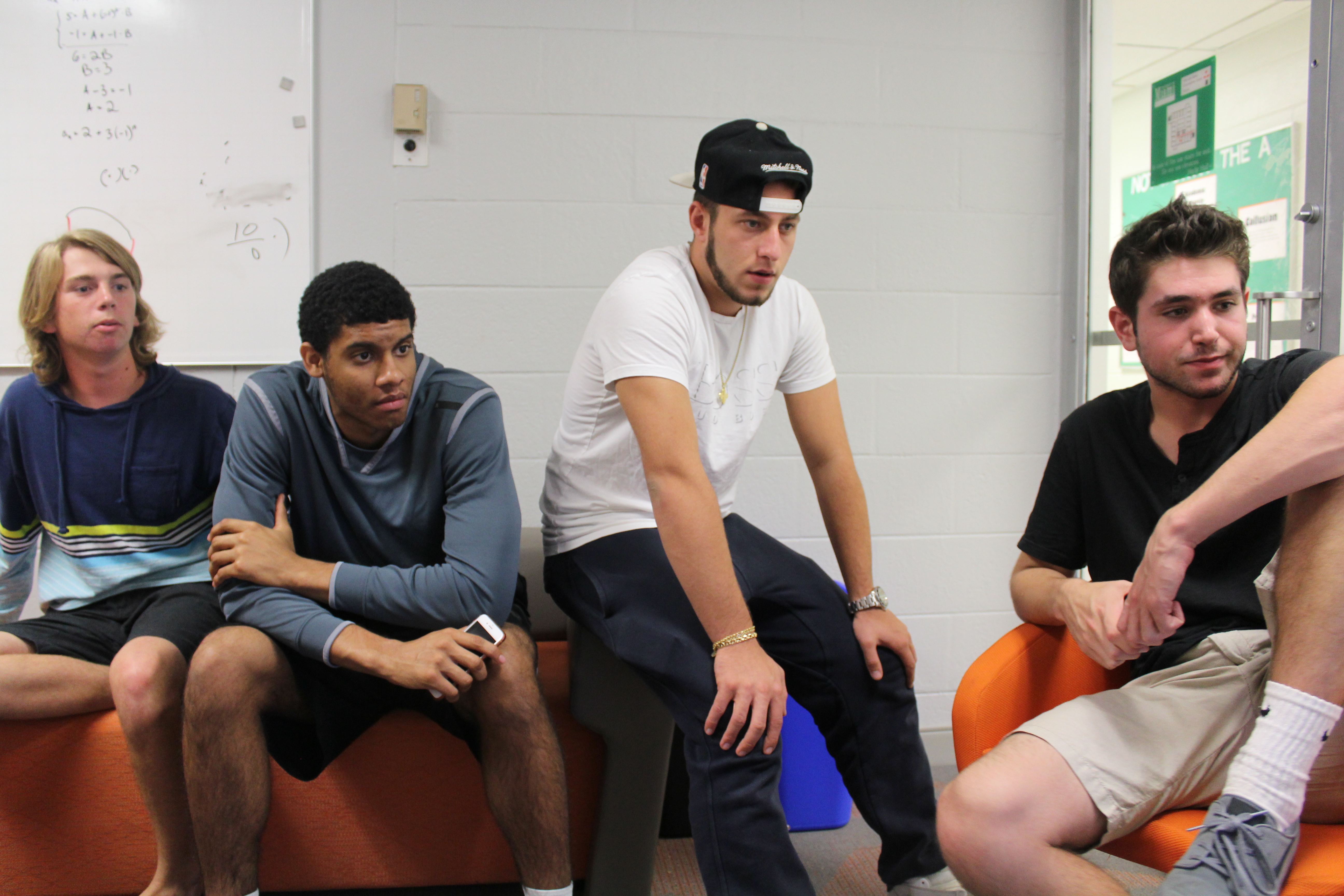 (From left to right) Freshmen Wyatt Melocik, Tachaka Ray, Bobby Geroulanos and Mike Martino watch a CNN broadcast of the most recent poll numbers. 