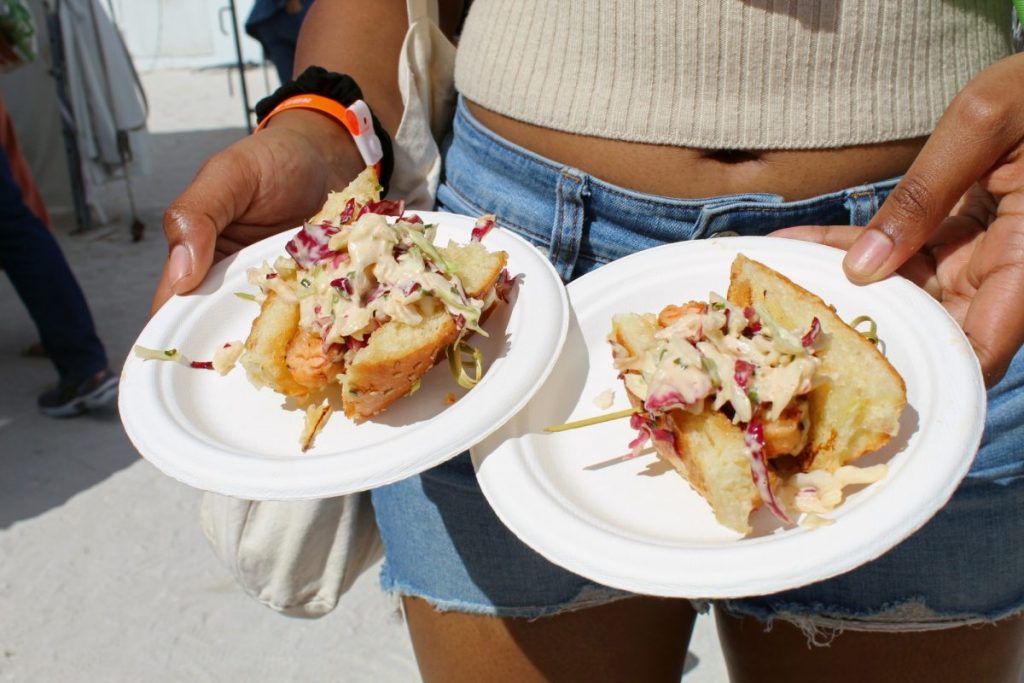 Swan, a Miami restaurant offering "chic modern Euro cuisine" serves lobster and shrimp sliders topped coleslaw at the 2020 South Beach Wine & Food Festival’s Goya Grand Tasting Village.