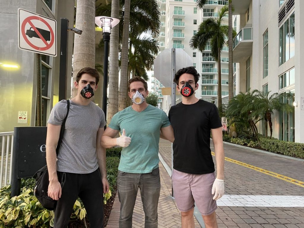 From left, Lance, Mitchell and Marc Levine make it back to their home base in Brickell after distributing another round of masks to the nearby homeless community on Sunday, May 4.