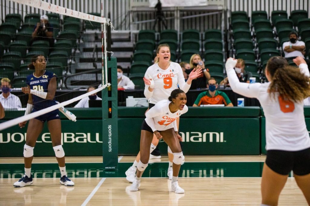Middle Blocker Janice Leao and members of the ‘Canes volleyball team celebrate after taking a one-set lead over the Georgia Tech Yellow Jackets at the Knight Sports Complex on Friday, Sept. 25.
