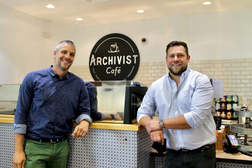 Founders Christopher Nolte (left) and Paul Massard (right), stand in the Archivist Café, located next to the Richter Library on campus, on Sept. 6.