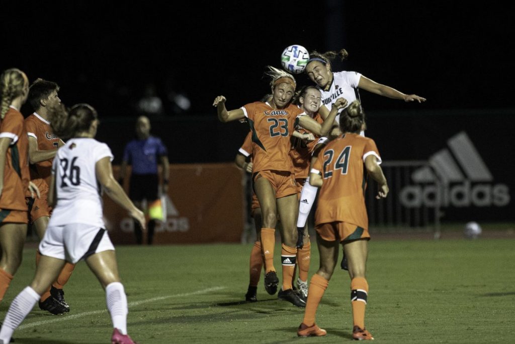 Senior Tia Dupont and freshman Julia Edwards jump to contest a header during Miami’s 3-0 loss versus Louisville on Thursday, Sept. 17. Louisville held Miami to 0 shots on goal throughout the game.