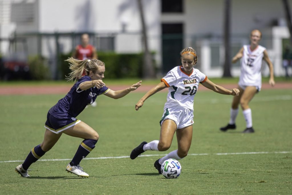 Freshman Michaela Baker fights to retain possession while bringing the ball up the field in Miami's 6-0 loss to Notre Dame at Cobb Stadium on Sunday, Sept. 20.