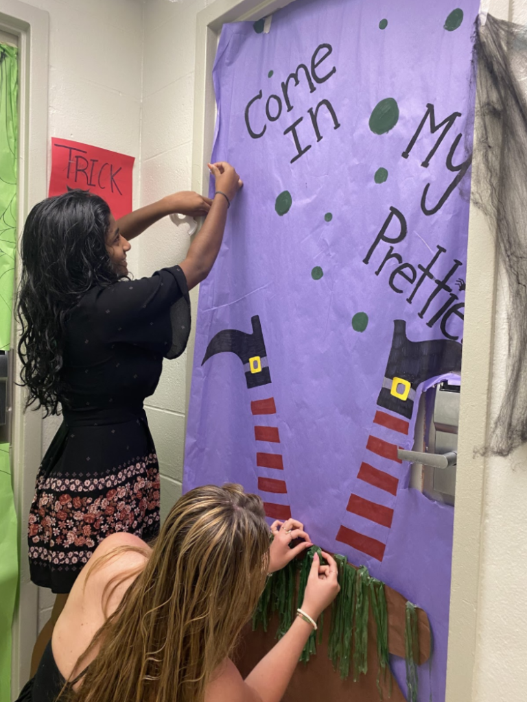 Abhirami Sriganeshan and her roommate Mikhala Stepek, both freshman at the University of Miami, put together a spooky door mural for visitors to admire this Halloween season.