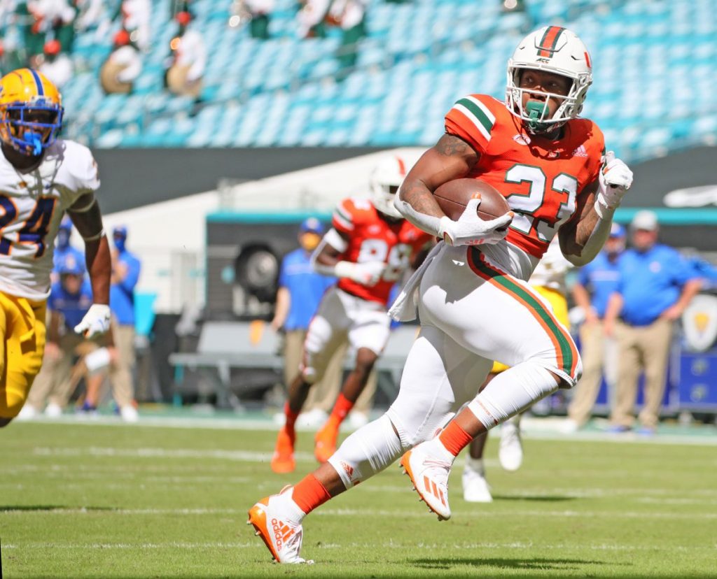 Running Back Cam'Ron Harris (23) runs for a first quarter touchdown after a reception during Miami's game versus Pittsburgh at Hard Rock Stadium in Miami Gardens, Florida on Saturday, Oct. 17.