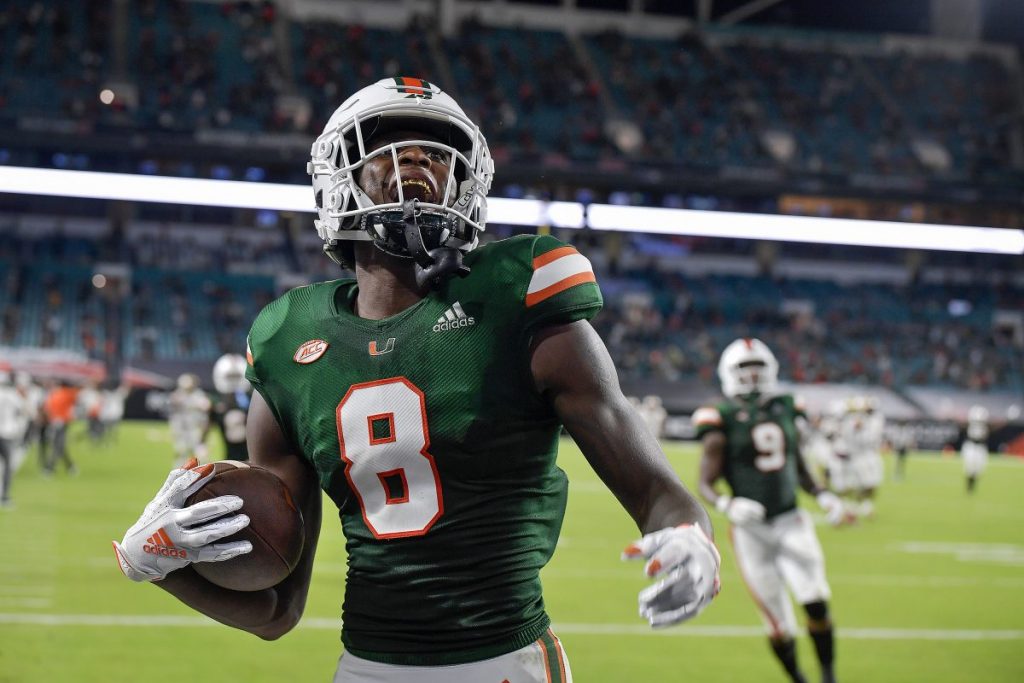 Wide Receiver Dee Wiggins (8) celebrates scoring a touchdown during the first half of Miami’s game versus Florida State on Sept. 26.