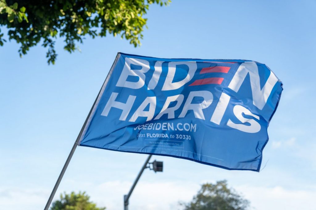 A Biden Harris sign flies at an intersection near the Coral Gables Library on Tuesday, Nov. 3.