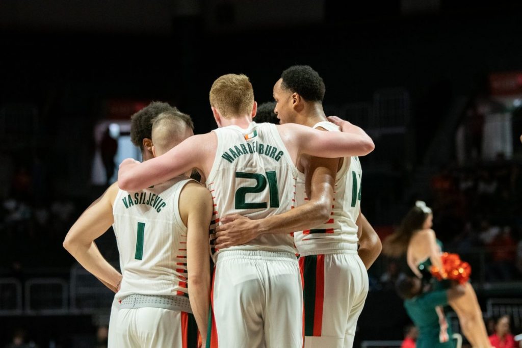 The 'Canes Men's Basketball team huddles during a timeout during Miami's game versus Pittsburgh in the Watsco Center on Feb. 2.