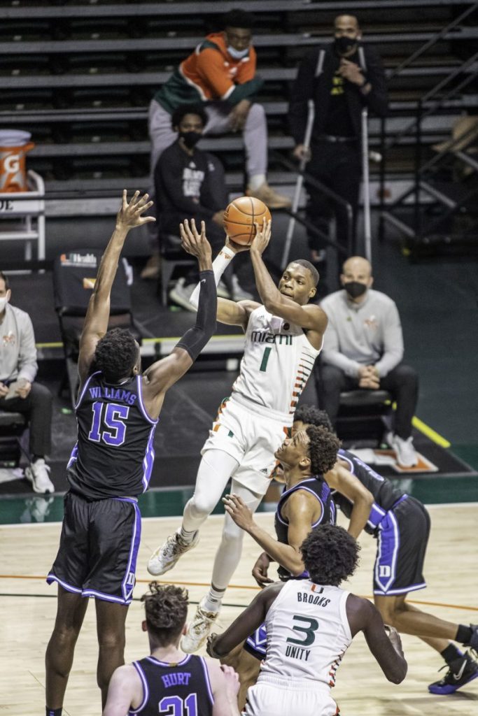Sophomore Anthony Walker attempts to pass during the late stages of Miami's win over Duke Monday Feb. 1. Walker had 16 points going 6-9 from the field, 1-2 from three, and 3-4 from the line.