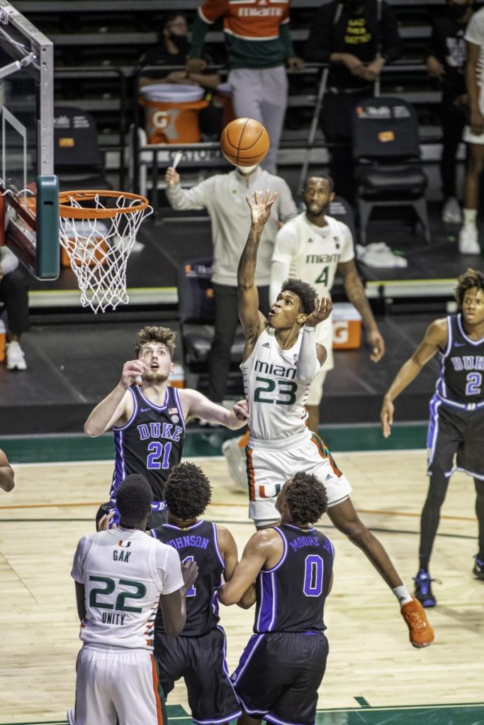 Redshirt Senior Kameron McGusty goes over the top of two Duke players for a bucket in Miami's win over Duke Monday Feb. 1. The Hurricanes shot 52.5% from the field and 53.8% from three point range.