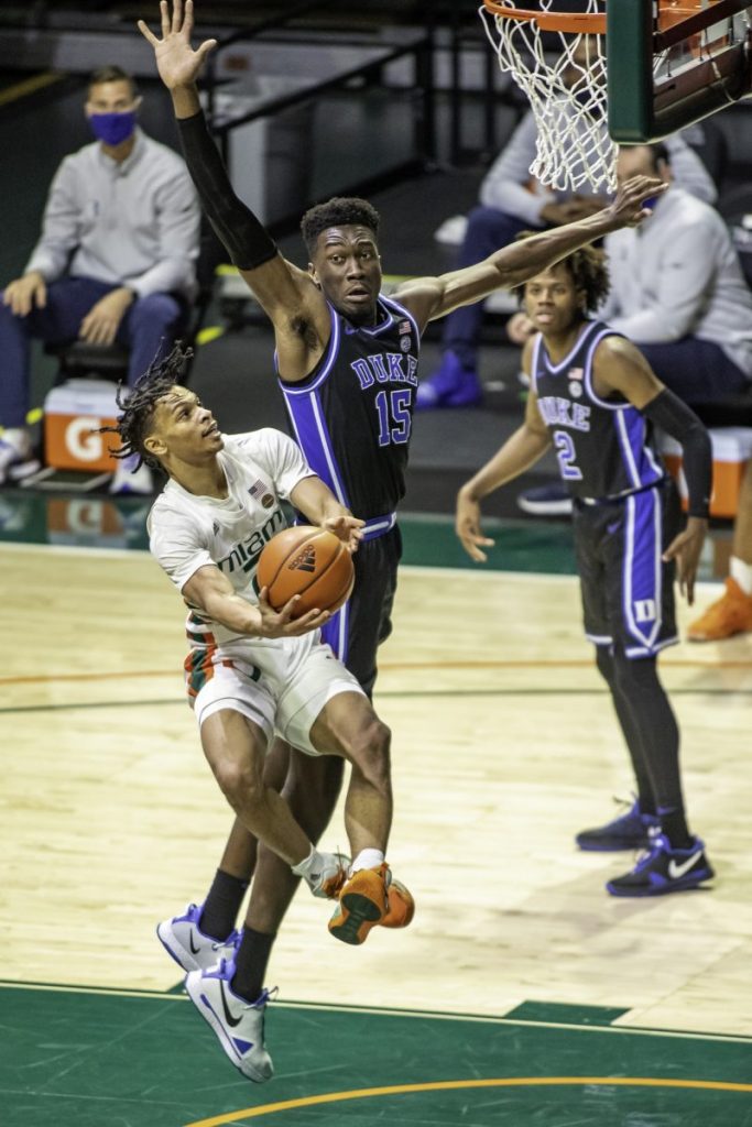 Sophomore Isaiah Wong attempts to draw a foul while he was on his way to 16 points against Duke Monday Feb. 1. The Hurricanes beat The Blue Devils 77-75 as Dukes final shot failed to hit the mark.
