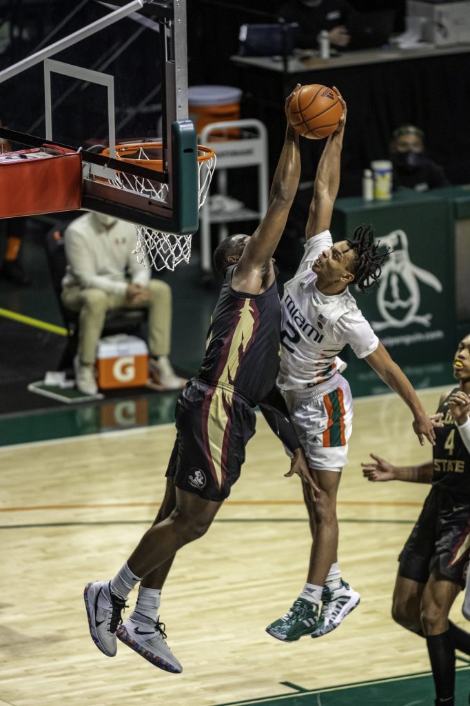 Sophomore Isaiah Wong gets rejected at the rim by Florida State's Raiquan Gray for one of Florida State's eight blocks against the Hurricanes. Wong scored a game high 29 points in Miami's loss to Florida State on Wednesday Feb. 24.