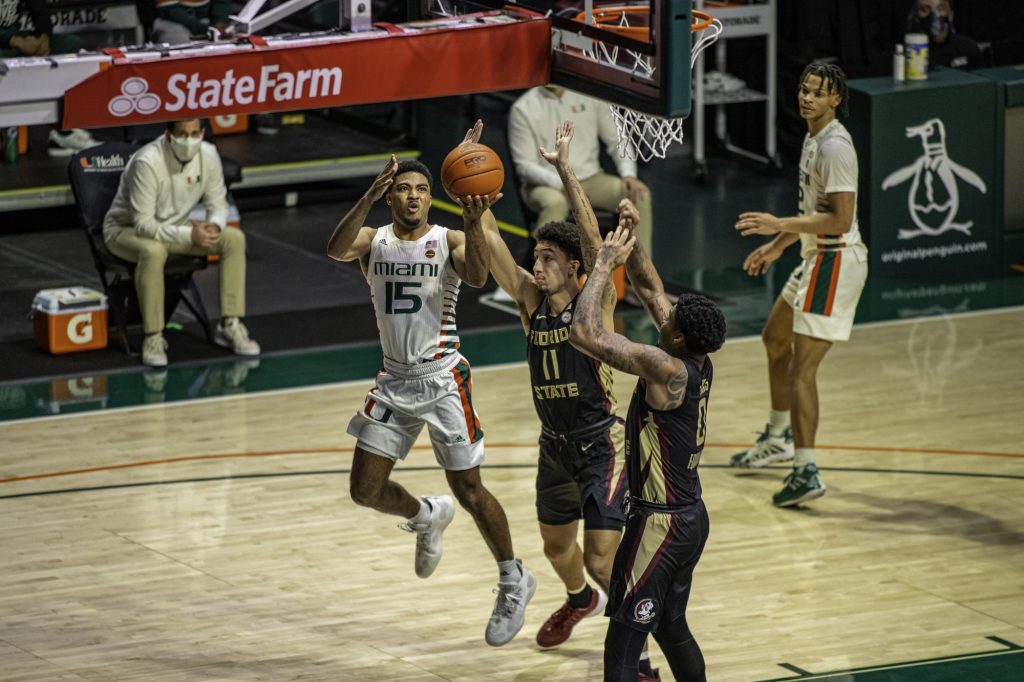Senior Guard Willie Herenton gets followed on an attempted shot during the second half of Miami's loss to Florida State on Wednesday Feb. 24. Herenton scored 5 points in his 11 minutes on the floor.