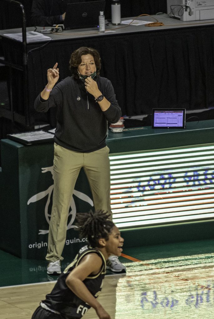 Coach Katie Meyer directs the Canes as they move up the court in the second half of Miami's victory over Wake Forest Thursday Feb. 25. The Canes move to 10-10 on the season.