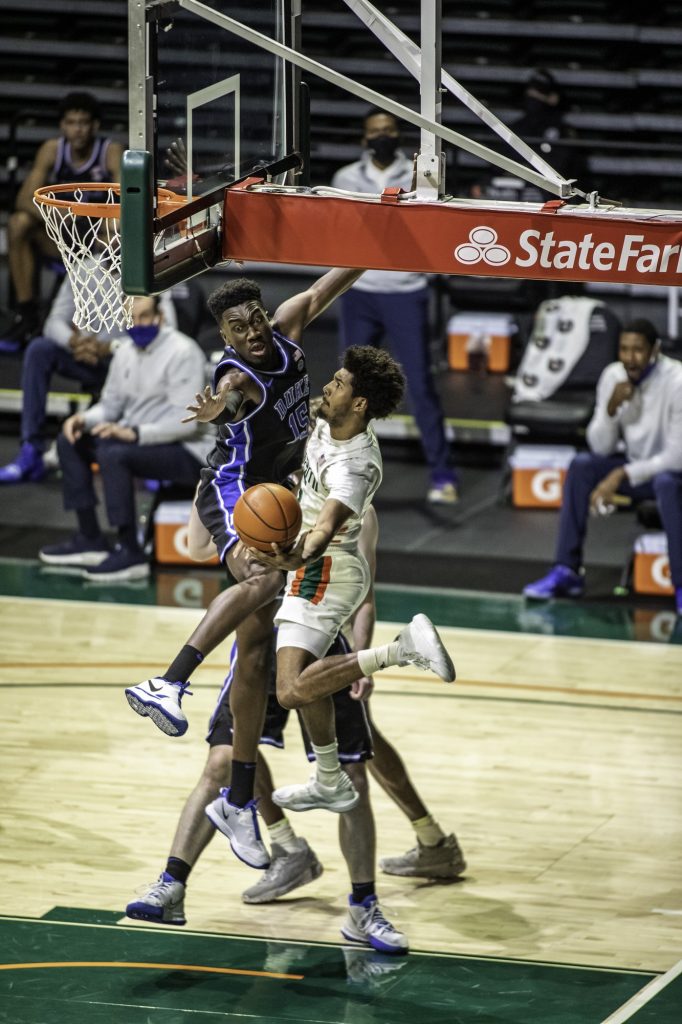 Sophomore Harlond Beverly reaches around the back of the basket in an attempt to make a shot in Miami's win over Duke on Monday, Feb. 1 at the Watsco Center. Beverly sat out the final few games of the regular season as well as the ACC tournament because of injury.