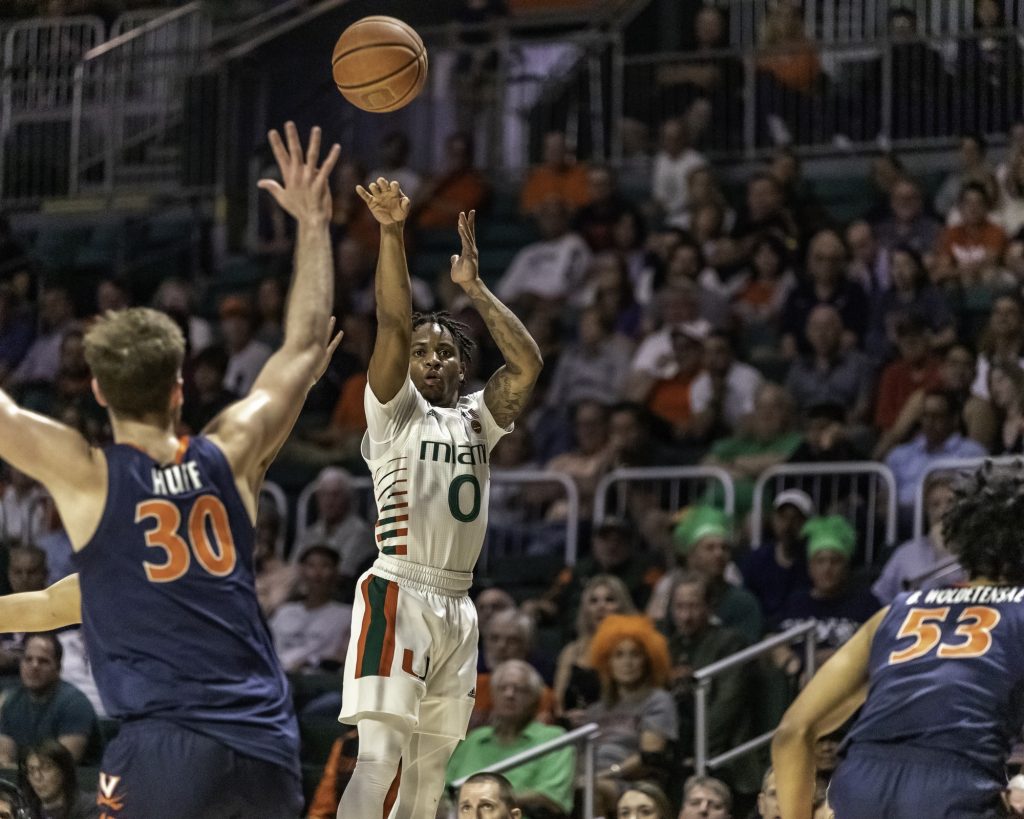 Junior guard Chris Lykes follows through on a 3-pointer near the end of the first half in Miami's loss over Virginia Wednesday, March 4.