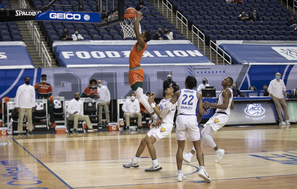 Miami’s Anthony Walker (1) gets a dunk during the second half against Pittsburgh on Tuesday, March 9, 2021 during the ACC Tournament at the Greensboro Coliseum in Greensboro, N.C.