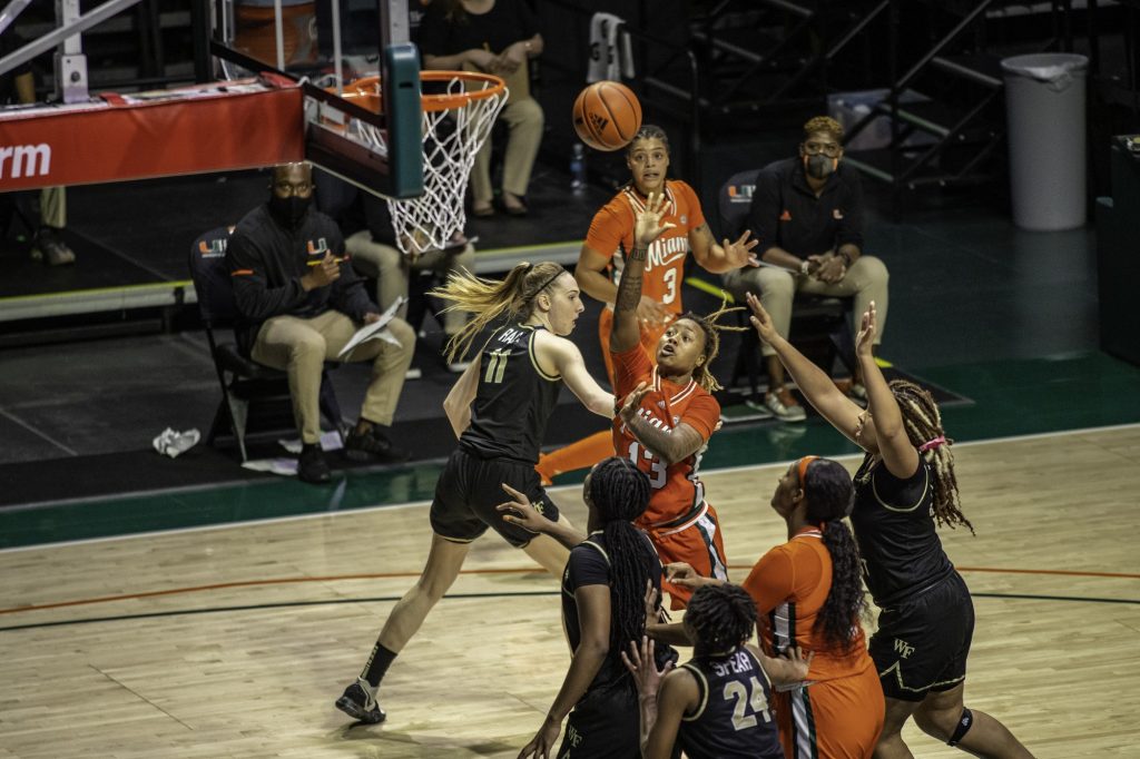 Senior Taylor Mason attempts a shot over a Wake Forest Defender in Miami's win on Thursday Feb. 25 at the Watsco Center. Miami finished the season 11-11 while going 8-10 within the ACC.