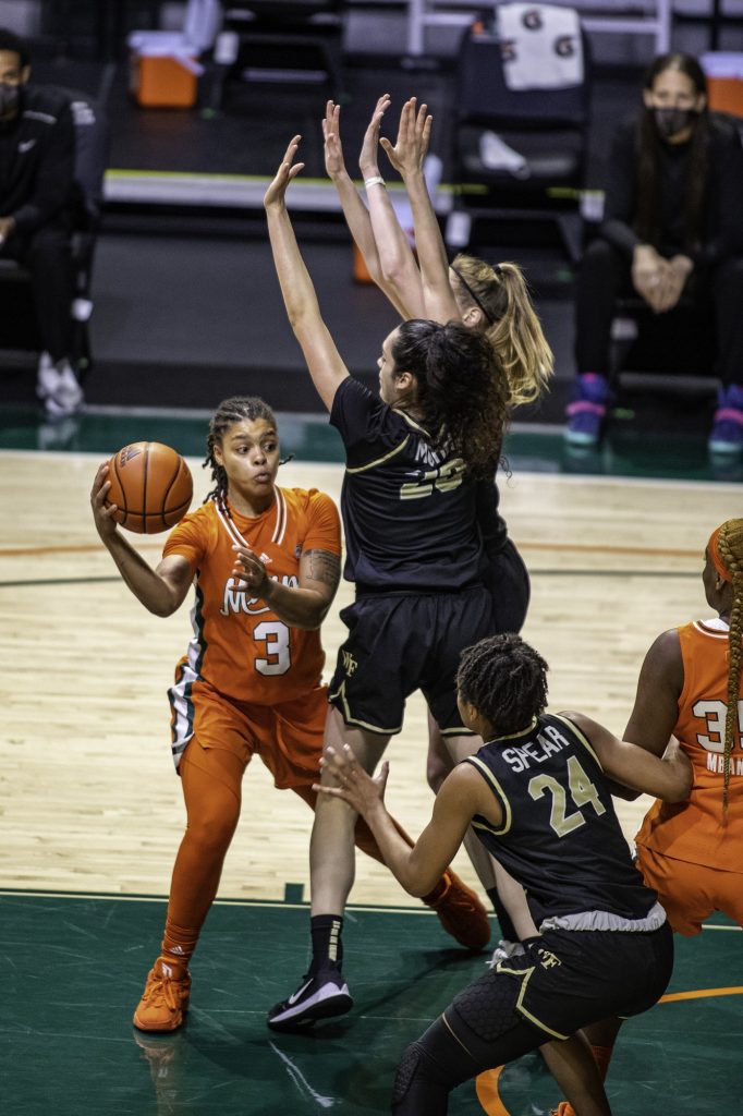Redshirt Junior Destiny Harden makes a pass around two Wake Forest defenders in Miami's win on Thursday Feb. 25 at the Watsco Center. Marshall Averaged 10 points per game and played in every game this season.