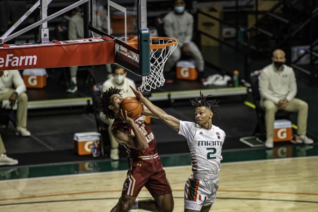 Sophomore Isaiah Wong tries to get a block, but ends up giving up a shooting foul during the first half of Miami's win over Boston College Friday Mar. 5. Wong put up nine points only shooting 3-11 from the field and 2-5 from three point range.