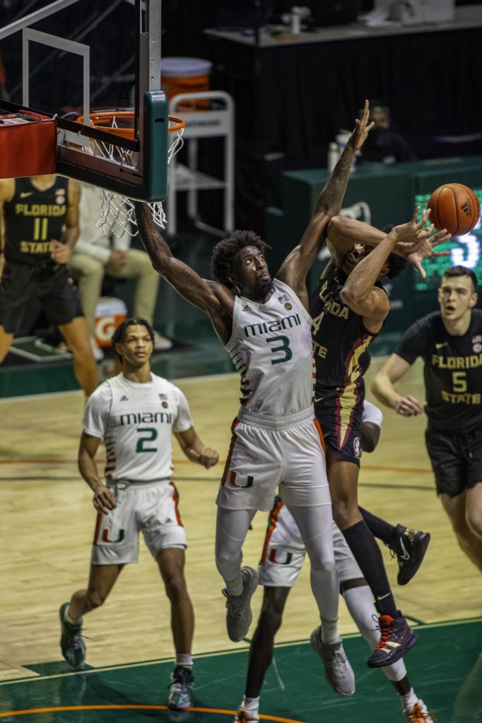Redshirt senior Nysier Brooks attempts to block a Florida State shot in Miami's loss on Wednesday Jan. 27 at the Watsco Center. Brooks led the team with 26 blocks on the season.