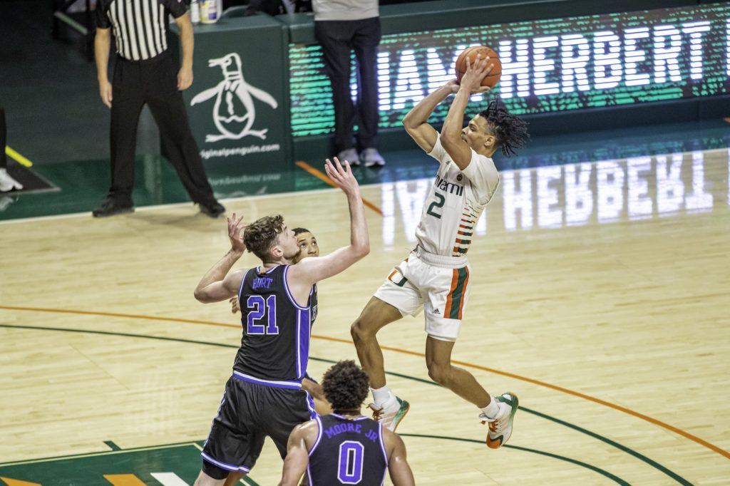 Sophomore guard Isaiah Wong shoots during Miami's game against Duke on February 1 at the Watsco Center.