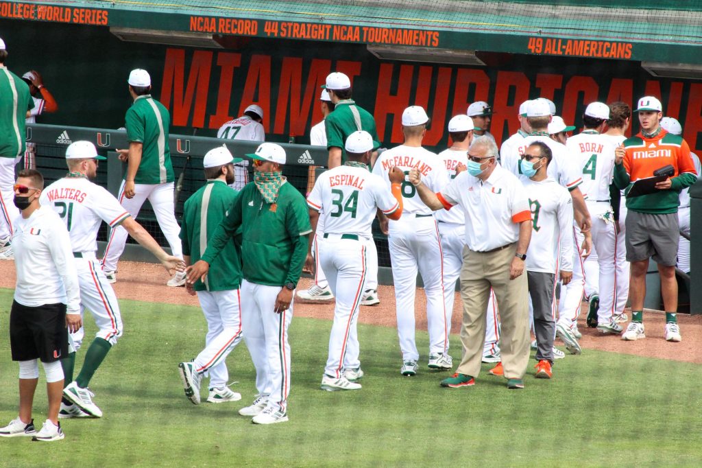 The Hurricanes celebrate after sweeping Duke on Sunday, April 4 at Mark Light Field.