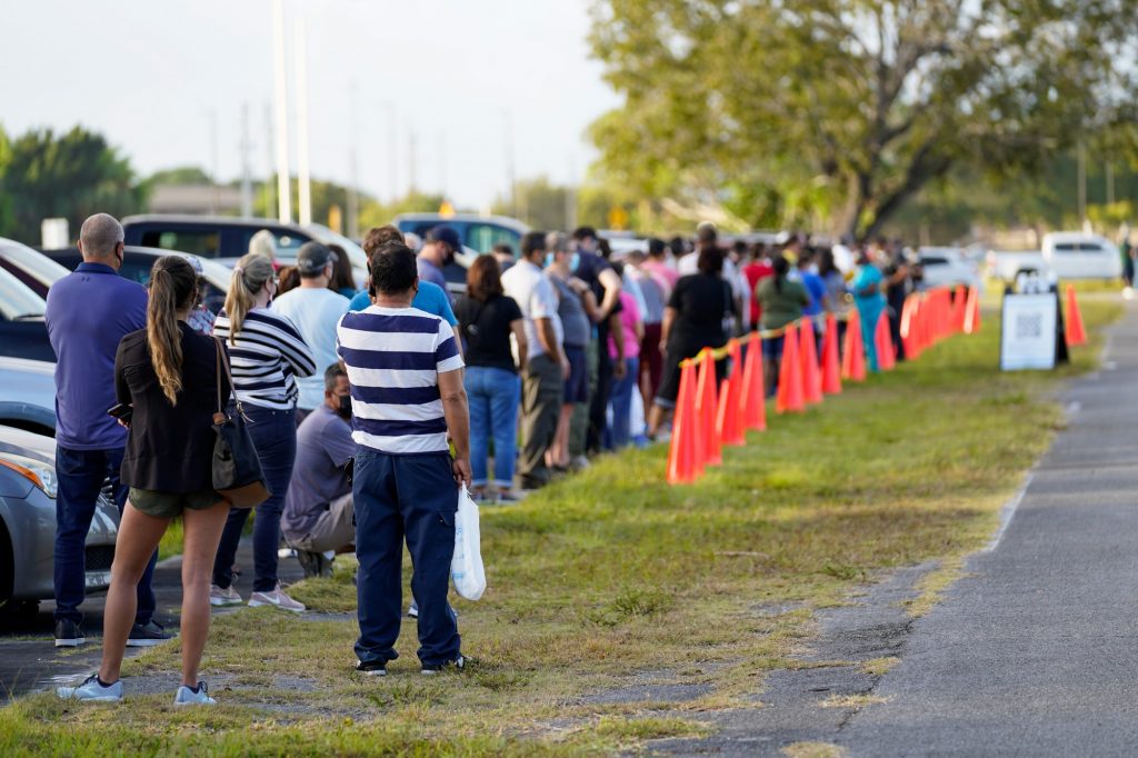 Florida residents line up at a county-supported pop-up vaccination site at Homestead Air Reserve Park on March 31. This vaccination site had 400 doses of the Johnson & Johnson COVID-19 vaccine available for individuals 40 years of age or older or those who qualified under another category within the eligibility requirements.