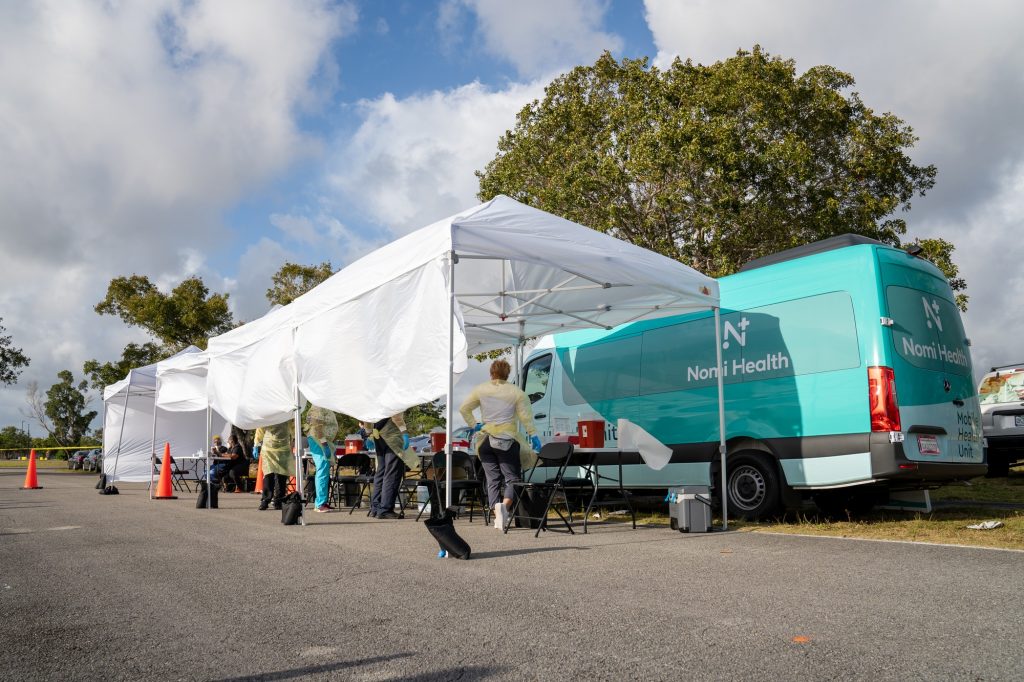 Site staff set up medical equipment and prepare to start vaccinations at Homestead Air Reserve Park on Wednesday, March 31, 2021.