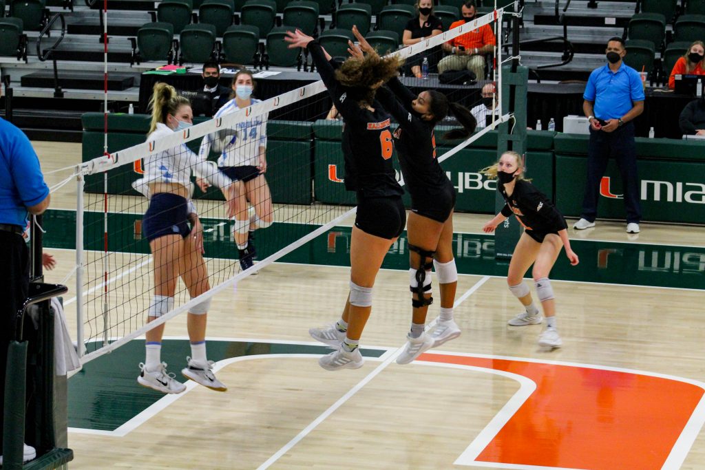 Miami attempts to deflect a UNC kill attempt during the match on April 3 at the Knight Sports Complex. Miami won the match 3-1.