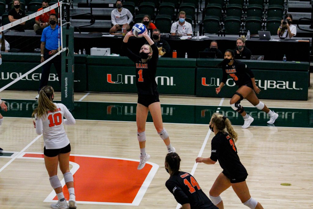 Miami sophomore setter Savannah Vach (1) sets the balls during Miami's match against the University of North Carolina on April 3 at the Knight Sports Complex.